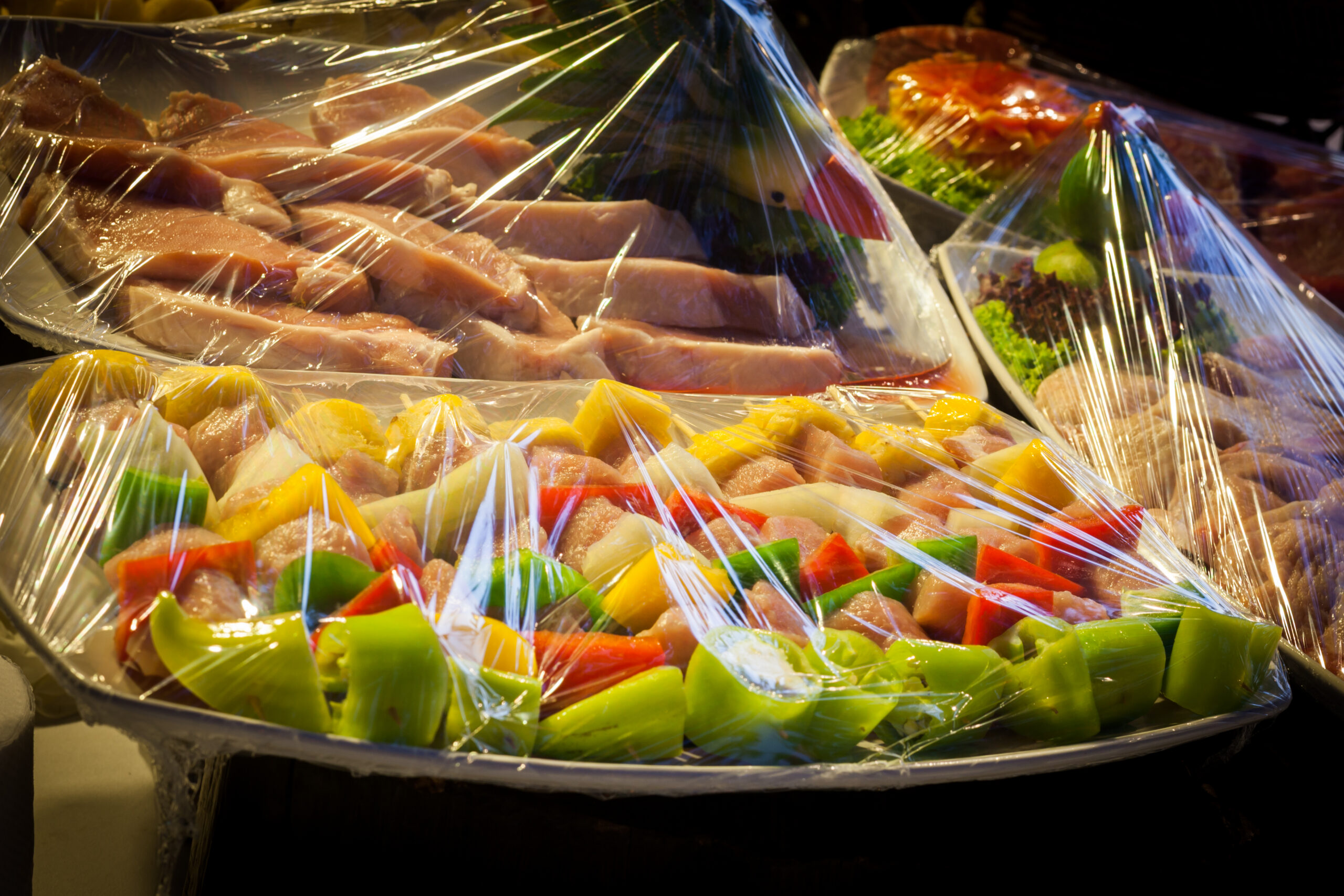 foods that are wrapped with plastic w - Adobe Stock